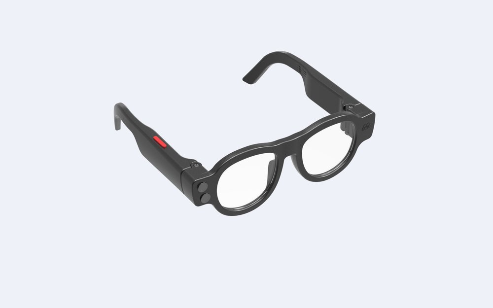 Mavis Itero smart glasses, a larger black frame with a red accent along the temple.